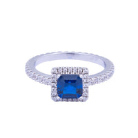 Beautiful classic style ring embellished with CZ stones and sapphire centre stone. Rhodium plating. Q539RTR